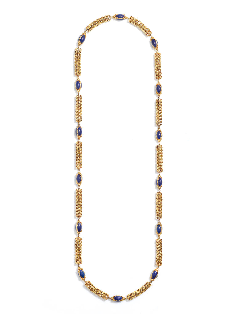 Georgian style yellow gold long chain with egg-shaped lapis beads placed every few inches. 14 lapis beads in total. The gold chain thick, with a braided effect. Photographed on a white background. 