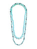 Two beaded necklaces. One a graduated strand of light blue to greenish-blue Persian turquoise bands with two small platinum diamond rondels at the clasp. The other strand alternating two sizes of round turquoise beads with black onyx rectangular beads and platinum and diamond rondels in  a repeating pattern. Photographed on a white background. 